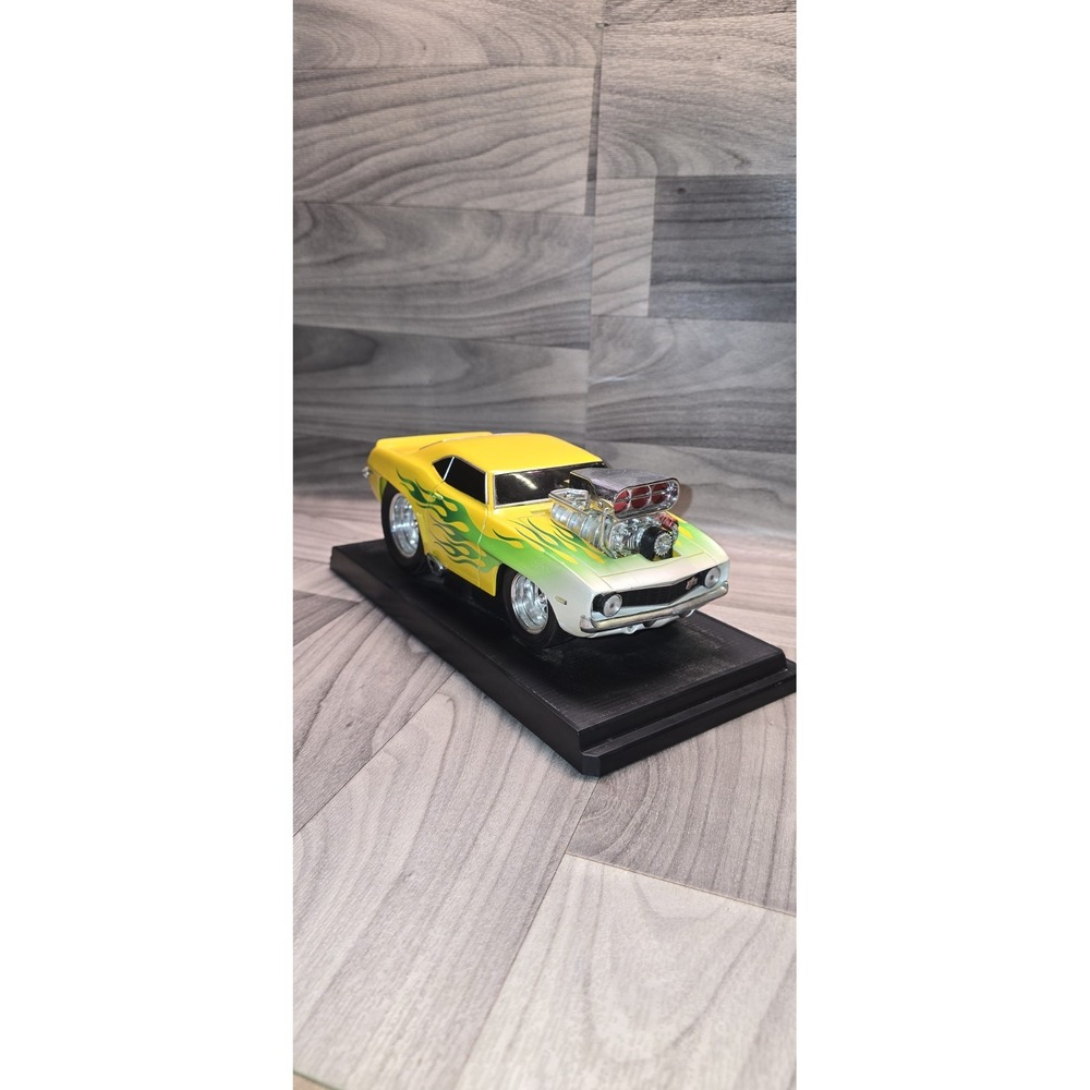 69 Chevy Camaro in Yellow and flames Muscle Machine 1:18 scale No Box